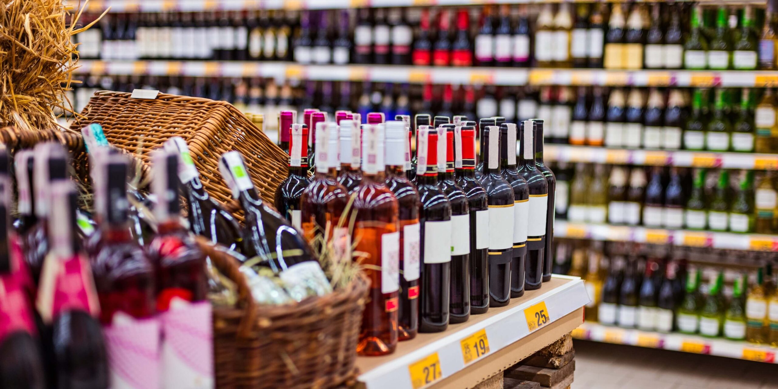 Alcohol section in suppermarket with wine bottles