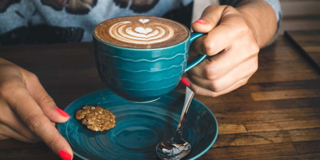 coffee cup in woman hands